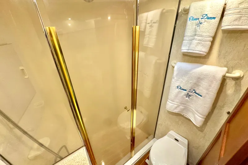 Slide: The Image of Bathroom interior of 1998 Ocean Yachts 48 Super Sport with shower and embroidered towels. - 19