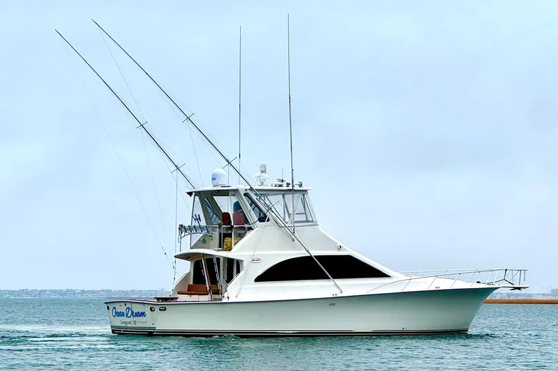 Slide: The Image of 1998 Ocean Yachts 48 Super Sport cruising on calm waters. - 3