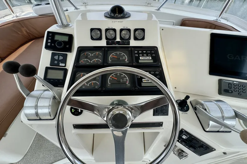 Slide: The Image of Helm of 1998 Ocean Yachts 48 Super Sport with gauges, controls, and navigation equipment. - 31