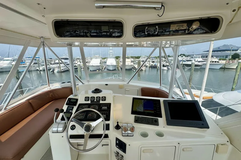Slide: The Image of Cockpit view of a 1998 Ocean Yachts 48 Super Sport at a marina. - 28