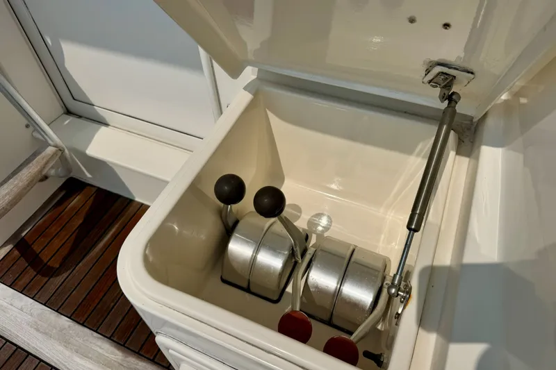 Slide: The Image of Engine controls of a 1998 Ocean Yachts 48 Super Sport, showcasing throttle levers. - 34
