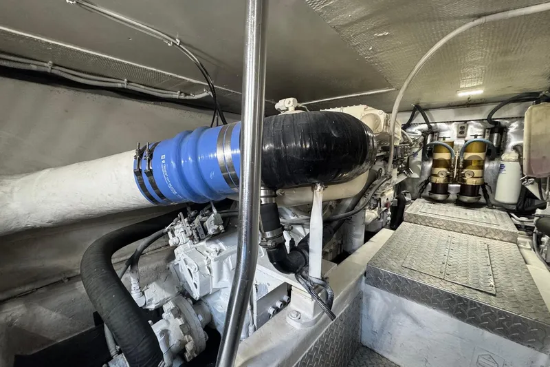Slide: The Image of Engine room of a 1998 Ocean Yachts 48 Super Sport, showcasing mechanical components. - 38