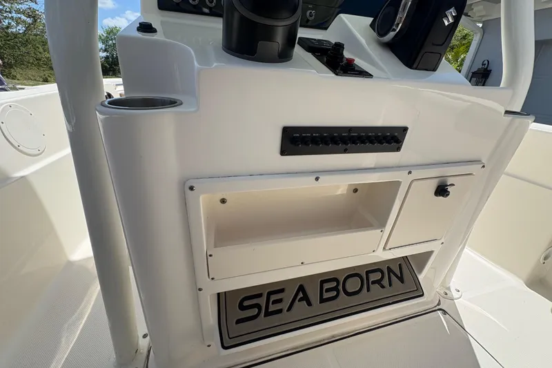 Slide: The Image of 2022 Sea Born LX22 Center Console boat with open storage compartments. - 11