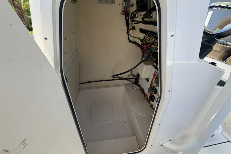 Slide: The Image of 2022 Sea Born LX22 Center Console dashboard with Simrad displays and steering wheel. - 17