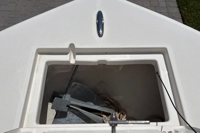 Slide: The Image of 2022 Sea Born LX22 Center Console boat interior with steering wheel and seating. - 22