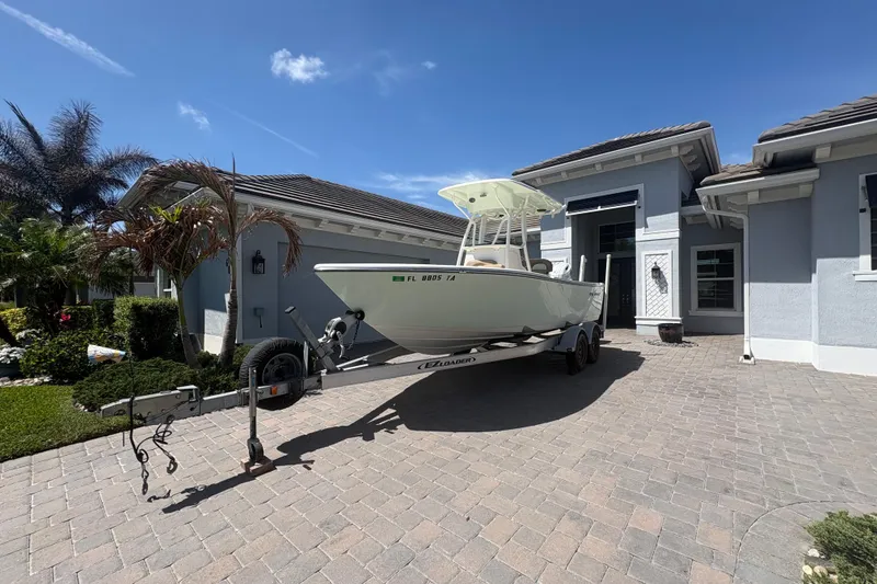 Slide: The Image of 2022 Sea Born LX22 Center Console interior with storage compartments and cup holder. - 27