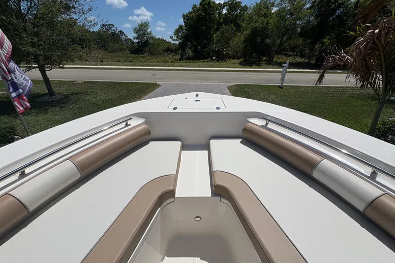 Slide: The Image of 2022 Sea Born LX22 Center Console boat parked in a driveway. - 5