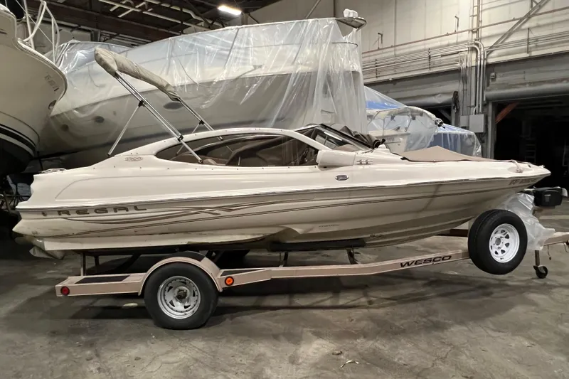 The Image of 2001 Regal 1900 LSR boat on trailer in indoor storage facility. - 0