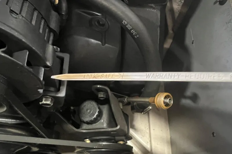 Slide: The Image of Engine compartment of a 2001 Regal 1900 LSR with dipstick and visible components. - 10