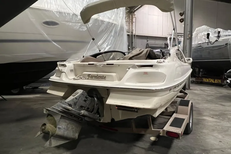 Slide: The Image of 2001 Regal 1900 LSR boat on trailer in indoor storage facility. - 11