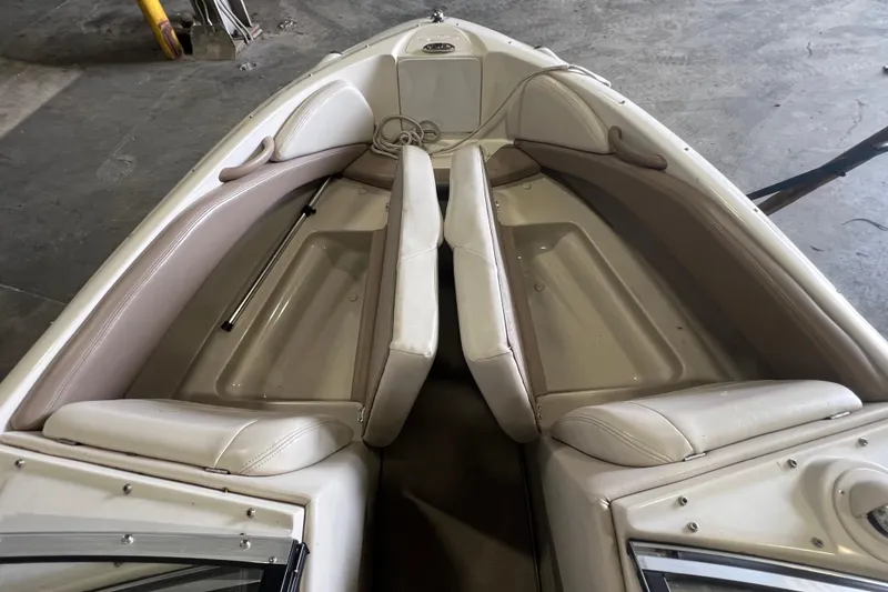 Slide: The Image of 2001 Regal 1900 LSR boat interior with beige seating and storage compartments. - 5