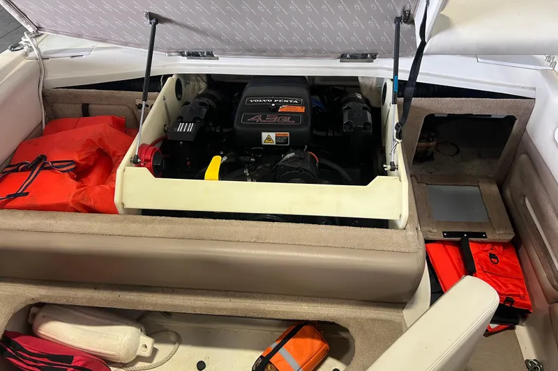 Slide: The Image of Open engine compartment of a 2001 Regal 1900 LSR boat with safety gear. - 8