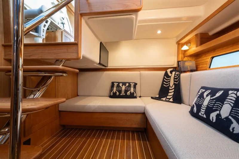 Slide: The Image of Luxurious interior of 2027 Sabre 38 Salon Express yacht with cozy seating and nautical decor. - 7