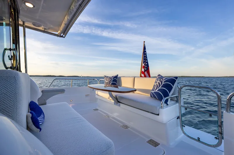 Slide: The Image of Luxurious 2027 Sabre 38 Salon Express yacht deck with elegant seating and ocean view. - 2