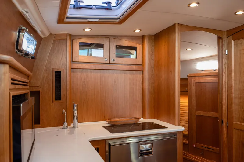 Slide: The Image of Luxurious interior of 2027 Sabre 38 Salon Express yacht with modern kitchen amenities. - 8