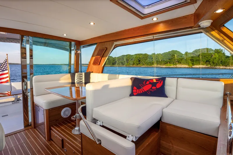 Slide: The Image of Luxurious interior of 2027 Sabre 38 Salon Express yacht with scenic ocean view. - 9