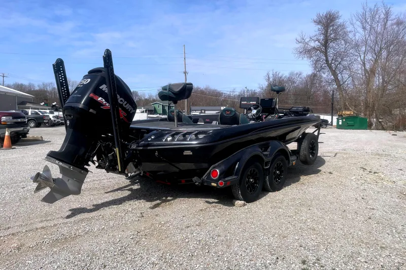 Slide: The Image of 2017 Ranger Z520 boat with Mercury engine on a gravel lot. - 4