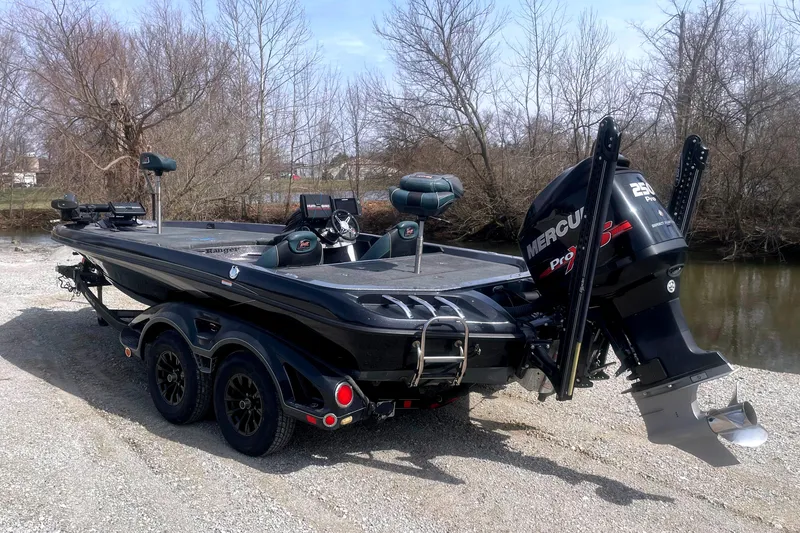 Slide: The Image of 2017 Ranger Z520 boat with Mercury Pro XS engine on a gravel path near water. - 5