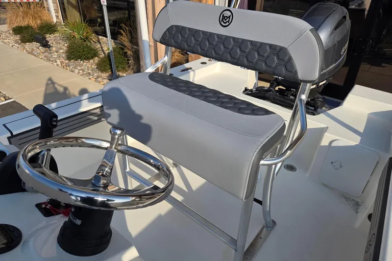Slide: The Image of 2026 May-Craft 182 Center Console boat interior with steering wheel and seating. - 10