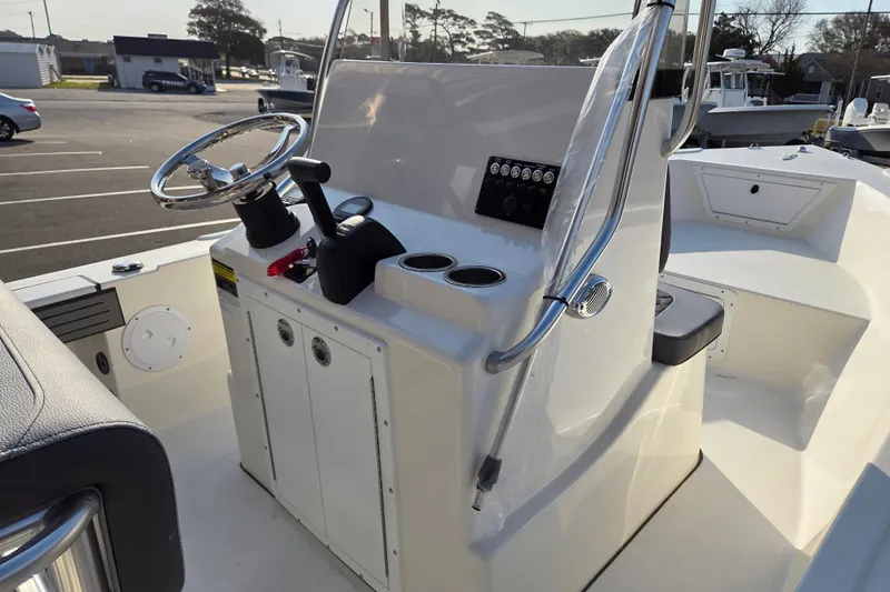 Slide: The Image of 2026 May-Craft 182 Center Console boat interior with steering wheel and control panel. - 12