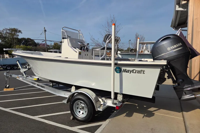 Slide: The Image of 2026 May-Craft 182 Center Console boat on trailer with Yamaha outboard motor. - 2