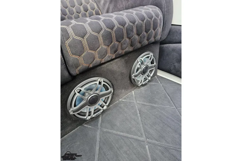 Slide: The Image of Speakers installed in a 2009 Nordic 36 Hurricane boat with hexagonal-patterned upholstery. - 107
