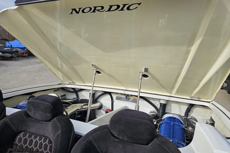 Slide: The Image of Open engine compartment of a 2009 Nordic 36 Hurricane boat, showcasing interior components. - 110