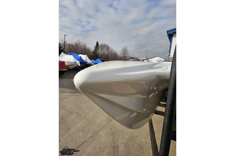 Slide: The Image of 2009 Nordic 36 Hurricane boat hull, parked outdoors under cloudy sky. - 14