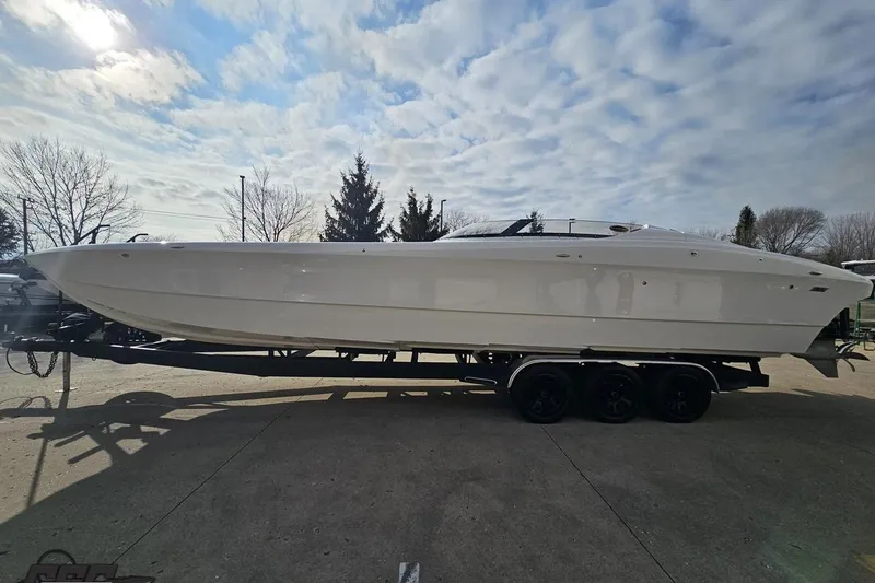 Slide: The Image of 2009 Nordic 36 Hurricane boat on trailer under cloudy sky. - 19
