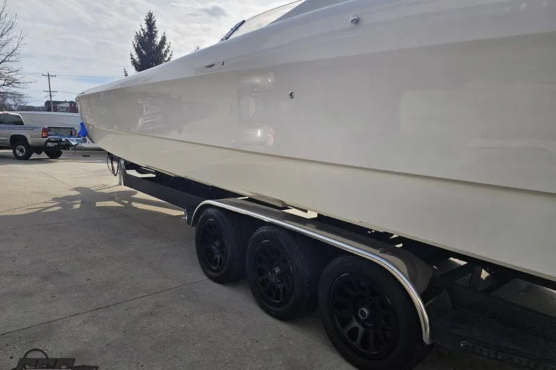 Slide: The Image of 2009 Nordic 36 Hurricane boat on trailer, side view in outdoor setting. - 21