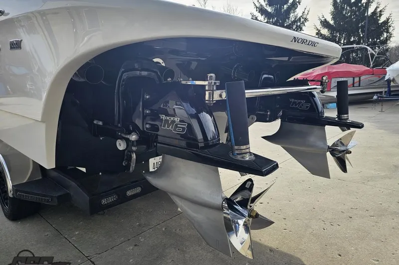 Slide: The Image of 2009 Nordic 36 Hurricane boat with dual propellers and sleek design. - 24