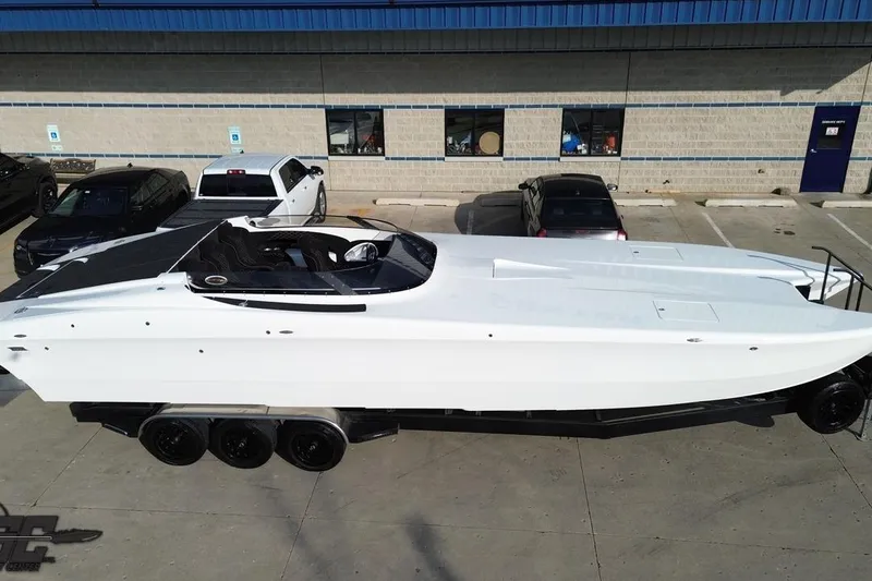 Slide: The Image of 2009 Nordic 36 Hurricane boat on trailer in parking lot, aerial view. - 31