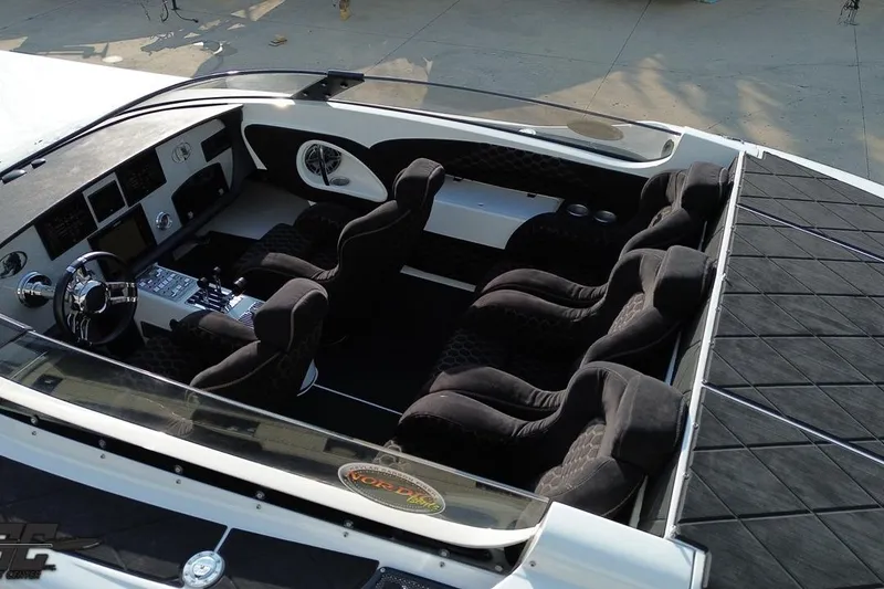 Slide: The Image of Interior of a 2009 Nordic 36 Hurricane boat with plush seating and modern dashboard. - 38