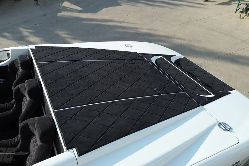 Slide: The Image of 2009 Nordic 36 Hurricane boat with black diamond-patterned deck cover. - 39