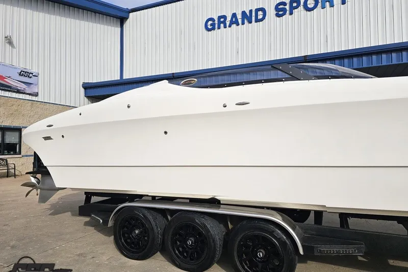 Slide: The Image of 2009 Nordic 36 Hurricane boat on trailer outside Grand Sport building. - 4