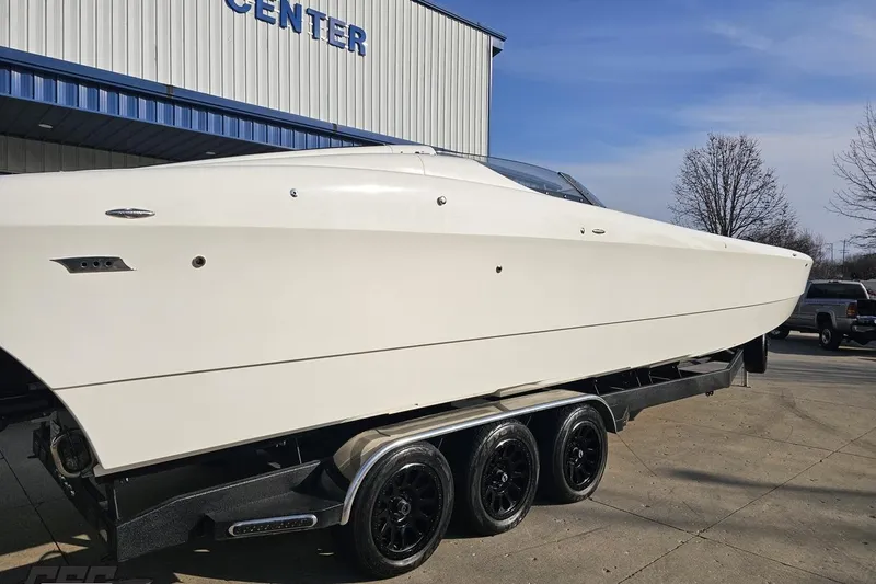 Slide: The Image of 2009 Nordic 36 Hurricane boat on trailer outside a service center. - 5