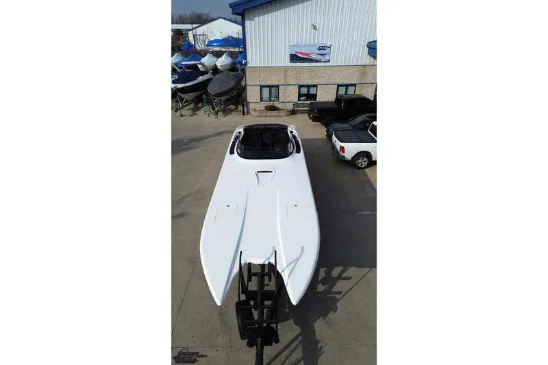 Slide: The Image of 2009 Nordic 36 Hurricane boat on trailer outside a marine facility. - 50