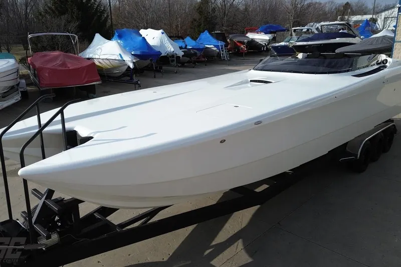 Slide: The Image of 2009 Nordic 36 Hurricane boat on trailer, surrounded by covered boats. - 53