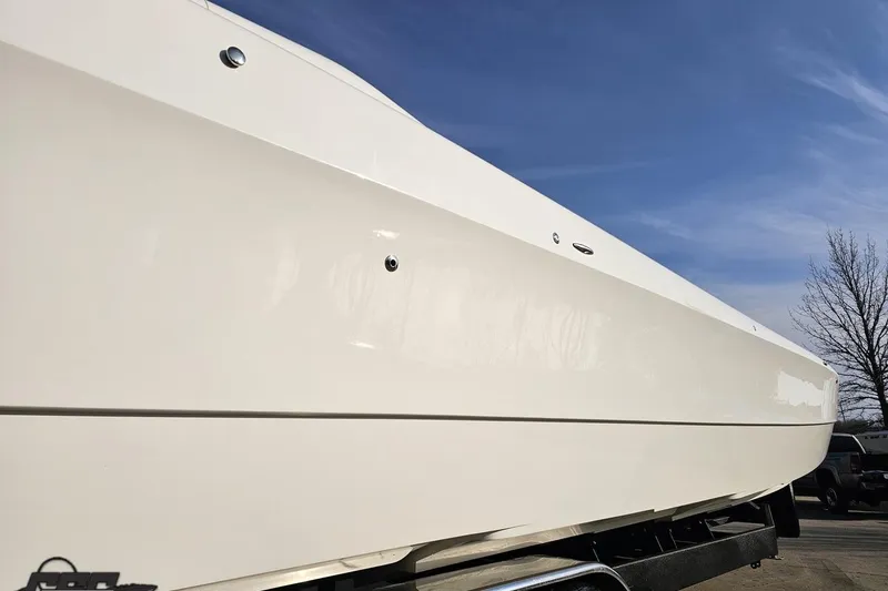 Slide: The Image of 2009 Nordic 36 Hurricane boat side view under clear blue sky. - 6