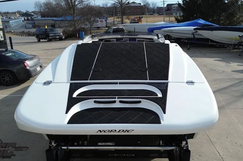 Slide: The Image of 2009 Nordic 36 Hurricane boat, rear view, parked outdoors on a sunny day. - 60