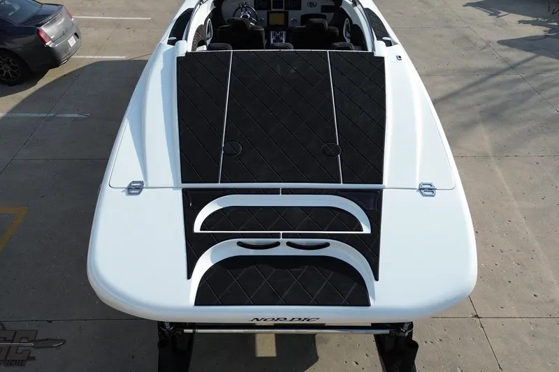 Slide: The Image of 2009 Nordic 36 Hurricane boat, aerial view, showcasing sleek design and black deck accents. - 62