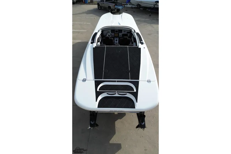Slide: The Image of 2009 Nordic 36 Hurricane boat, aerial view, white with black accents, parked on concrete. - 63