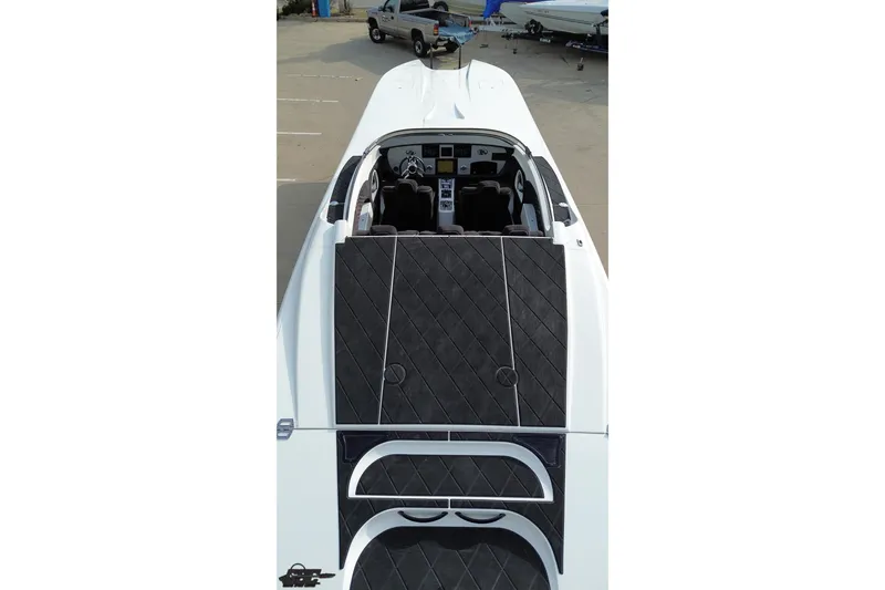 Slide: The Image of 2009 Nordic 36 Hurricane boat with sleek black and white design, viewed from above. - 64