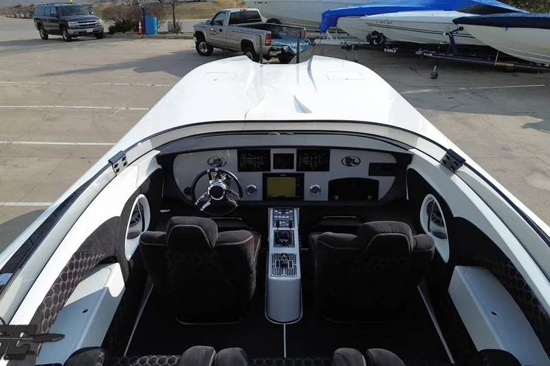 Slide: The Image of Interior view of a 2009 Nordic 36 Hurricane boat, showcasing the cockpit and controls. - 67