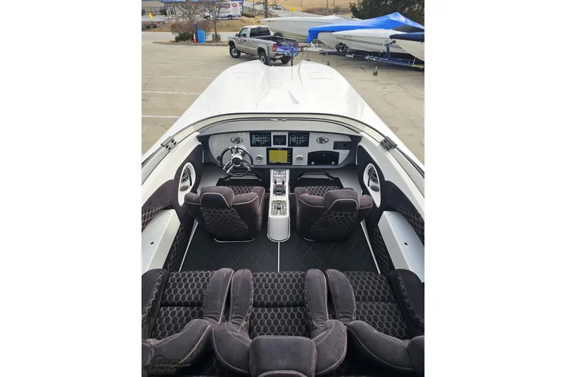 Slide: The Image of Interior view of 2009 Nordic 36 Hurricane boat with plush seating and modern dashboard. - 69