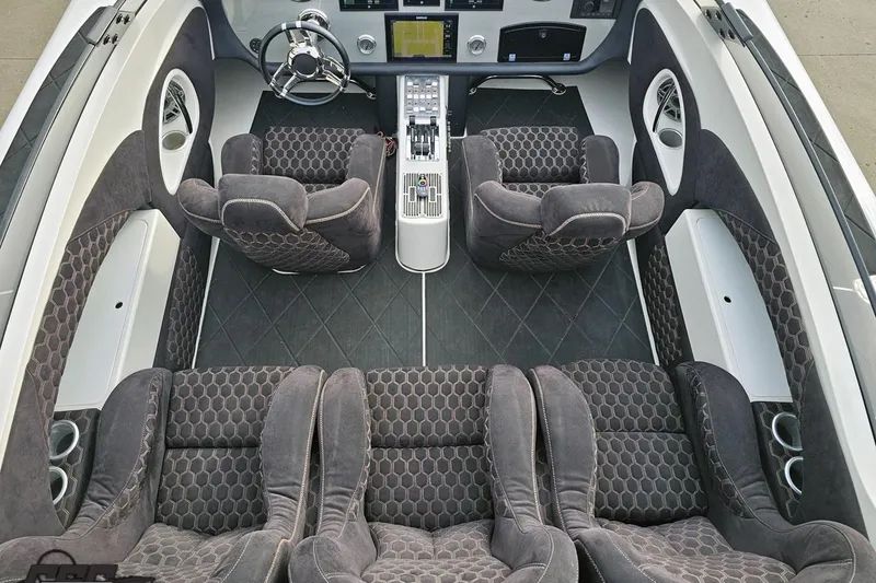 Slide: The Image of Interior of a 2009 Nordic 36 Hurricane boat with plush seating and modern dashboard. - 70