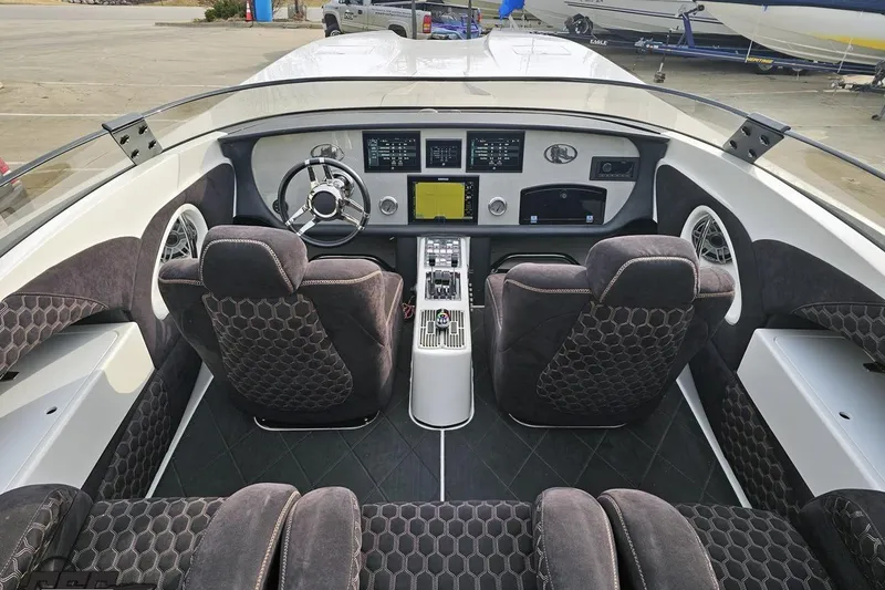 Slide: The Image of Interior of a 2009 Nordic 36 Hurricane boat with modern dashboard and seating. - 71