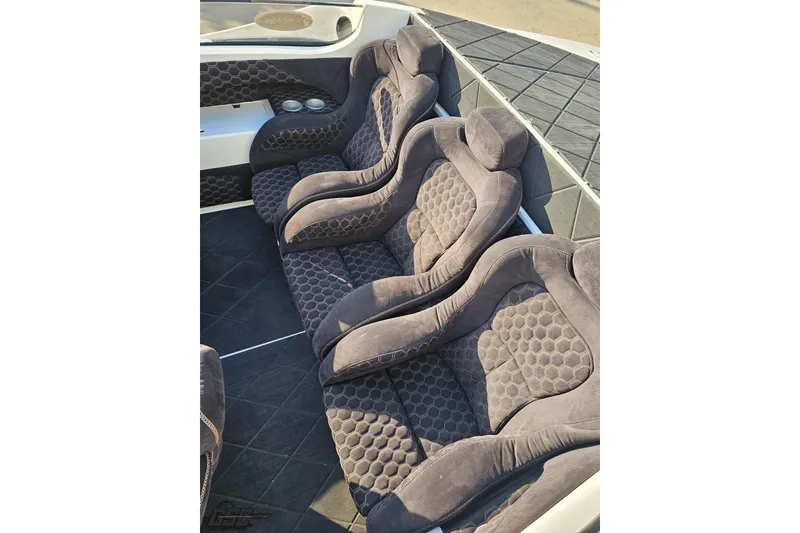 Slide: The Image of Luxurious seating in a 2009 Nordic 36 Hurricane boat, featuring plush, textured upholstery. - 73