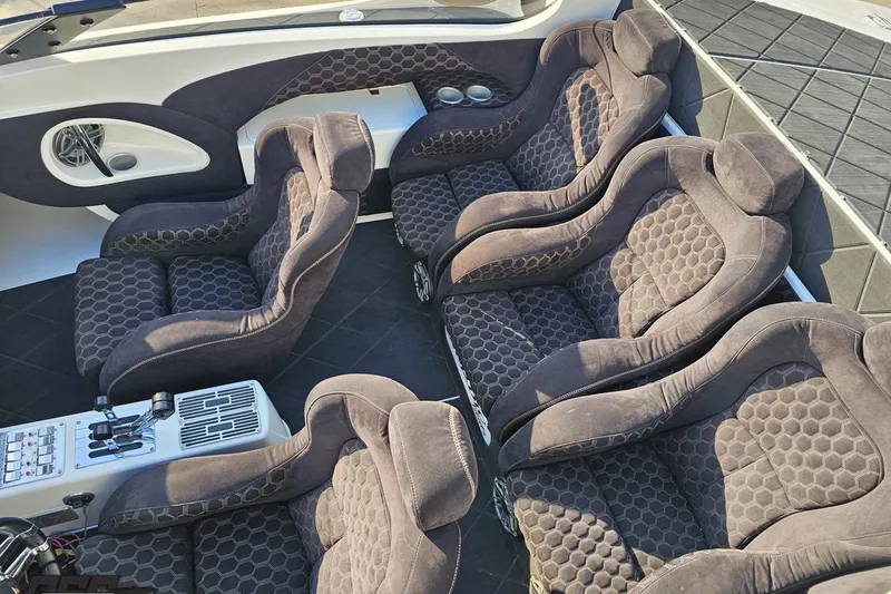 Slide: The Image of Luxurious seating in a 2009 Nordic 36 Hurricane boat, featuring plush, patterned upholstery. - 74