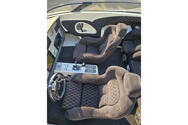 Slide: The Image of Luxurious interior of a 2009 Nordic 36 Hurricane boat with plush seating and modern controls. - 76